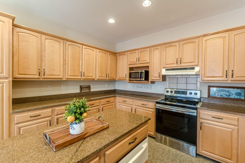 4346 Leola Road Douglasville, GA 30135 - Photo 21 of 59 a kitchen with appliances cabinets and a counter top space