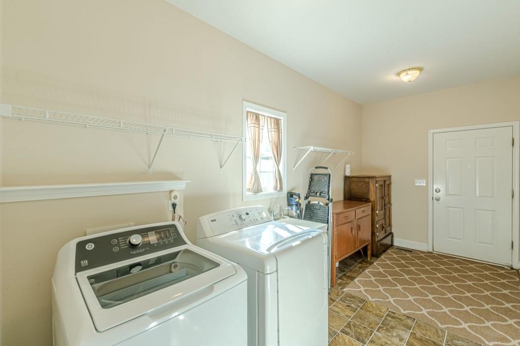 4346 Leola Road Douglasville, GA 30135 - Photo 23 of 59 a utility room with dryer and washer