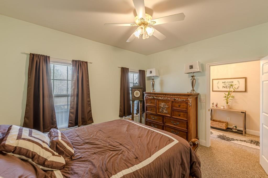 4346 Leola Road Douglasville, GA 30135 - Photo 26 of 59 a bed sitting in a bedroom and view of living room