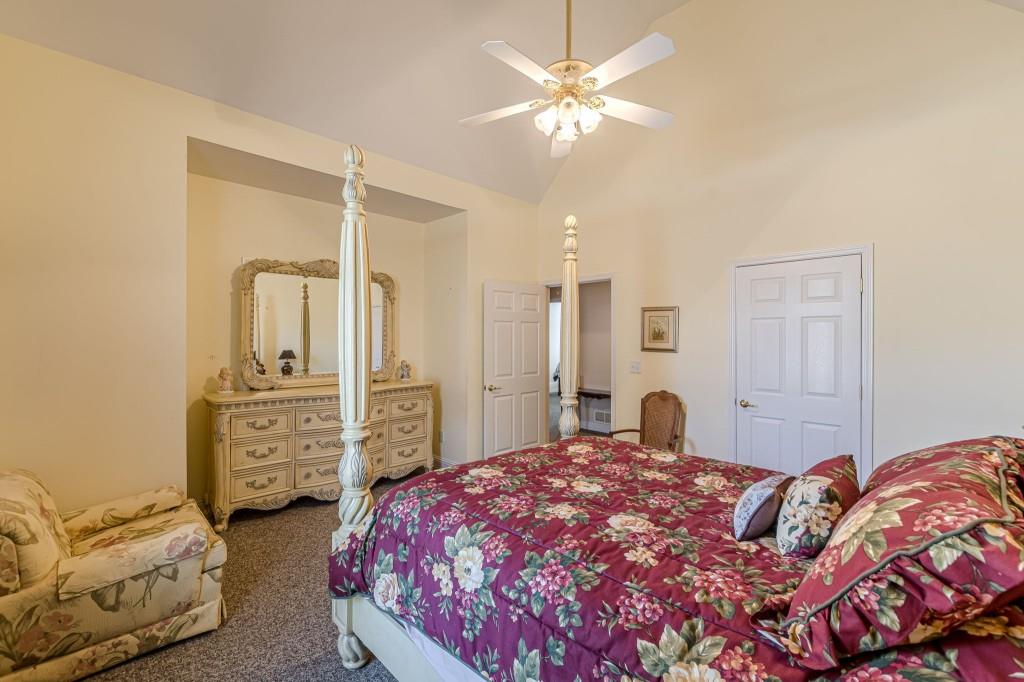 4346 Leola Road Douglasville, GA 30135 - Photo 41 of 59 a bedroom with a bed and dresser
