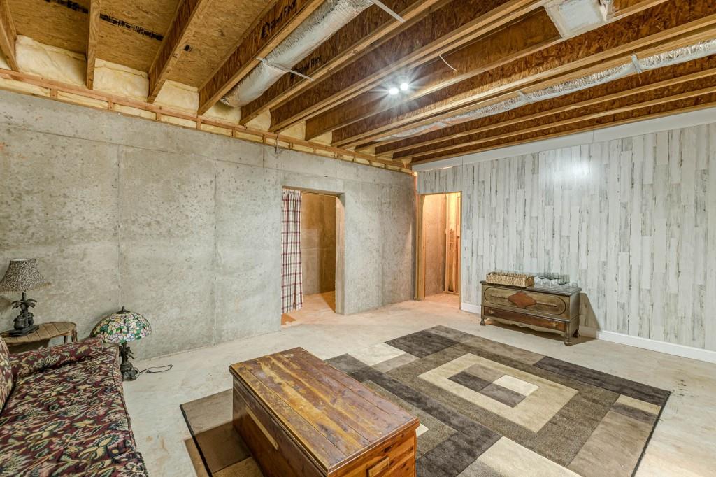 4346 Leola Road Douglasville, GA 30135 - Photo 48 of 59 a bedroom with a bed and a couch