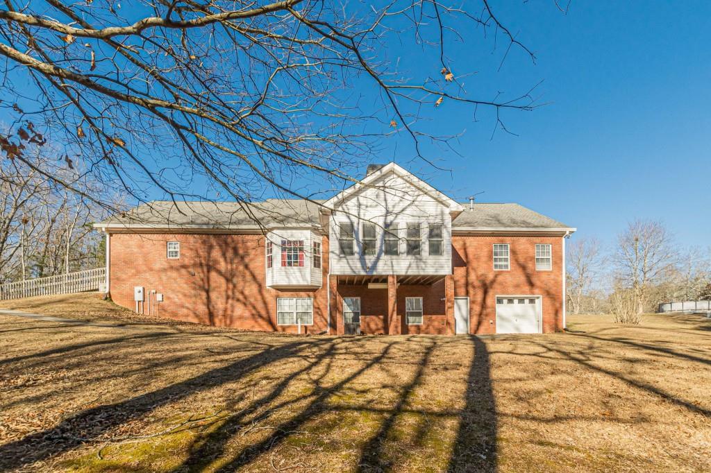 4346 Leola Road Douglasville, GA 30135 - Photo 56 of 59 a view of a house with a backyard