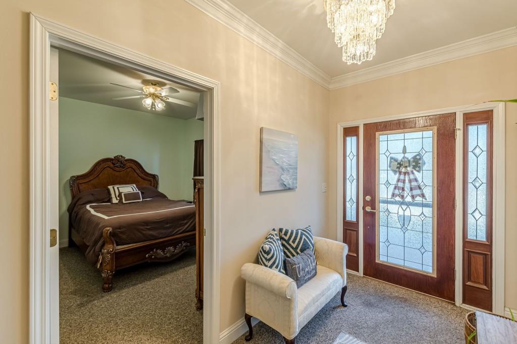 4346 Leola Road Douglasville, GA 30135 - Photo 7 of 59 a living room with furniture and a chandelier