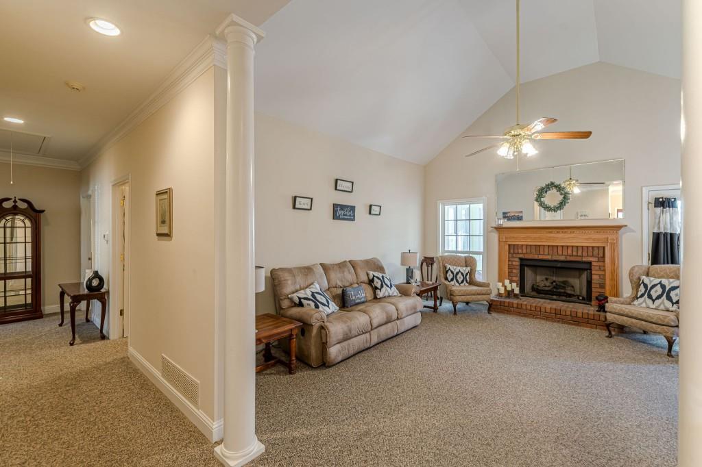 4346 Leola Road Douglasville, GA 30135 - Photo 8 of 59 a living room with furniture and a fireplace