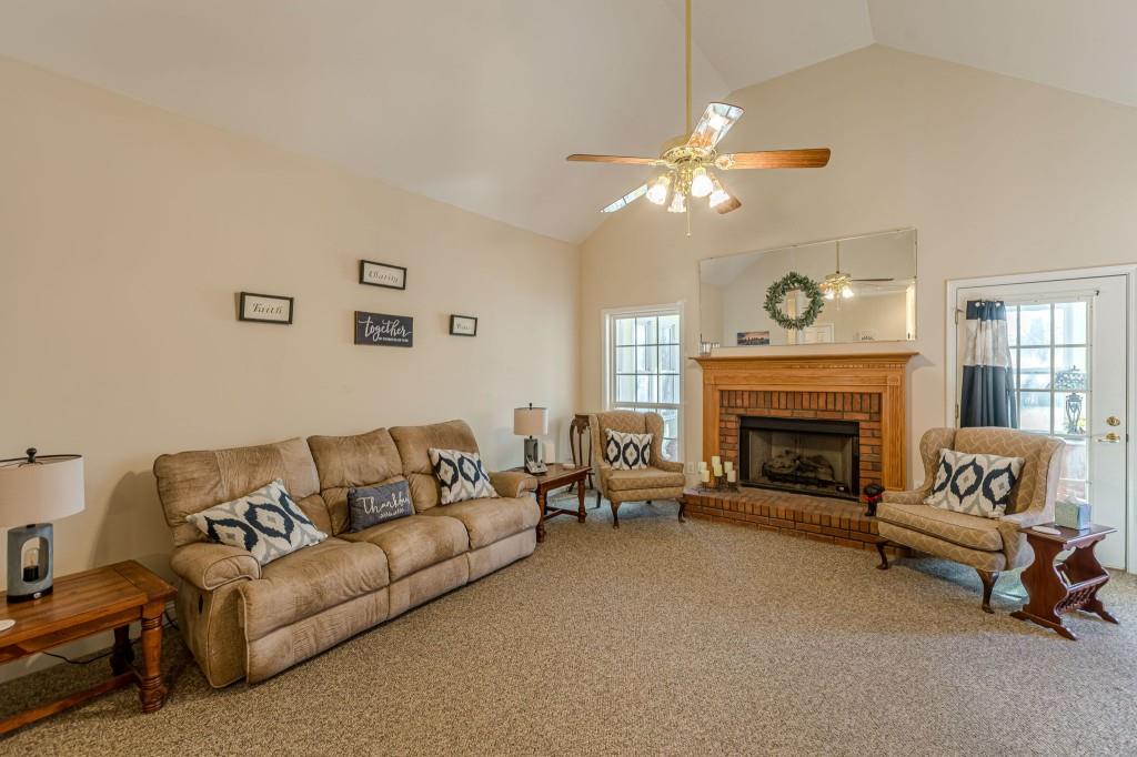4346 Leola Road Douglasville, GA 30135 - Photo 9 of 59 a living room with furniture and a fireplace