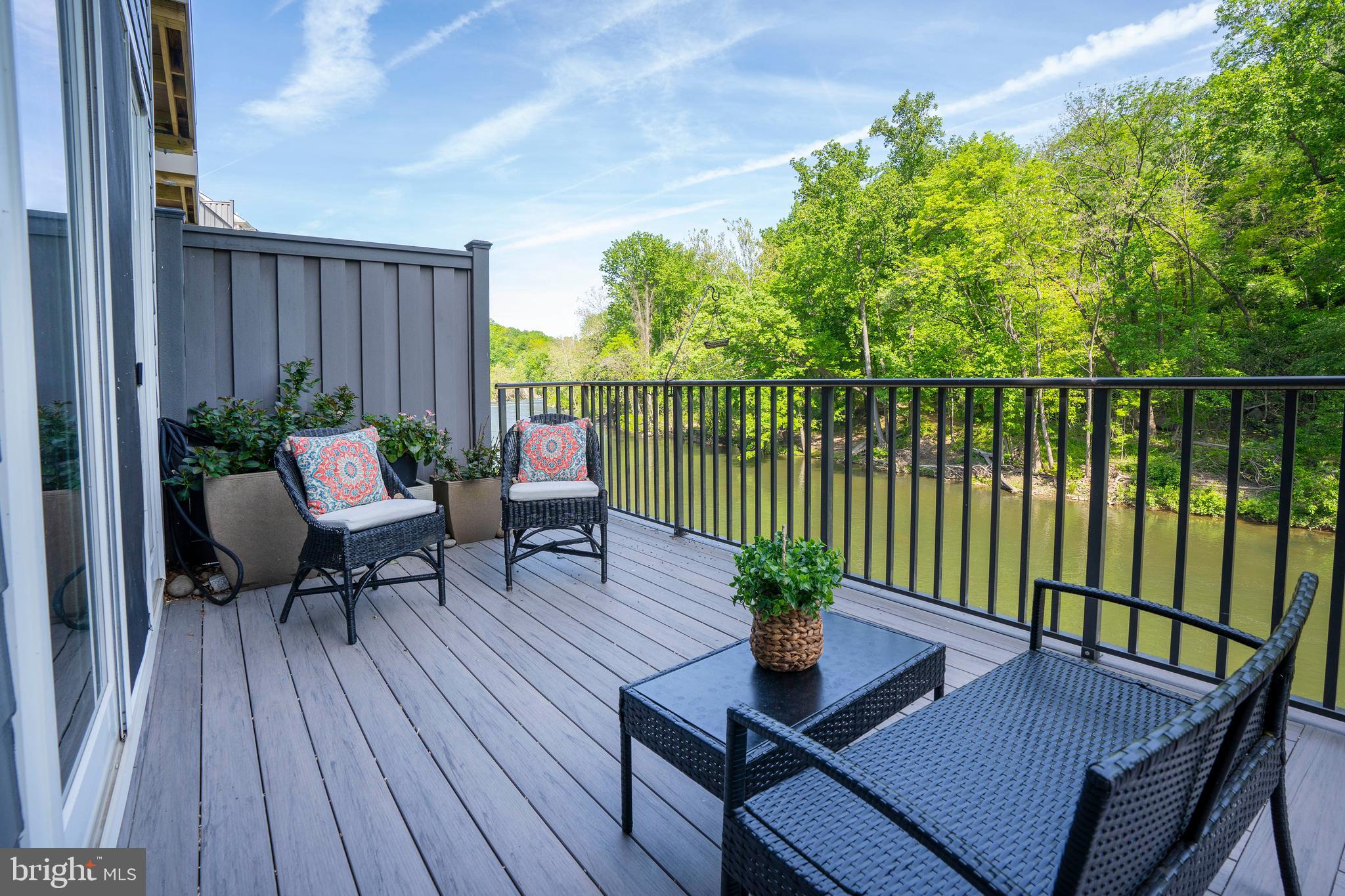 118 Bancroft Mills Road Wilmington, DE 19806 - Photo 15 of 36 a view of balcony with wooden floor outdoor seating and plants