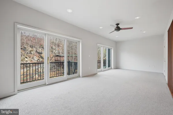 a view of an empty room with windows
