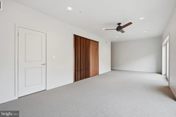 a view of a livingroom with a ceiling fan