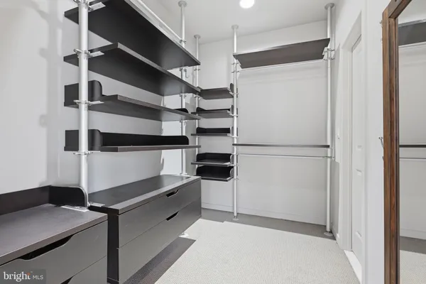 a kitchen with cabinets and a refrigerator