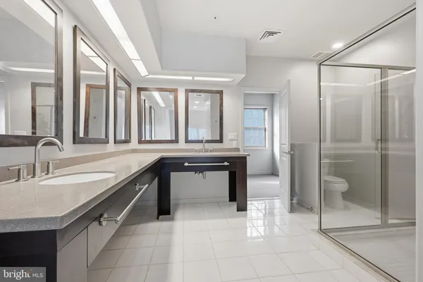 a view of an empty room with a cabinet