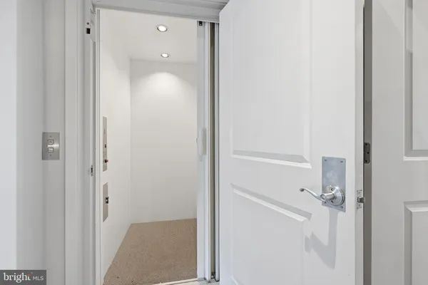 a view of a bathroom from a hallway