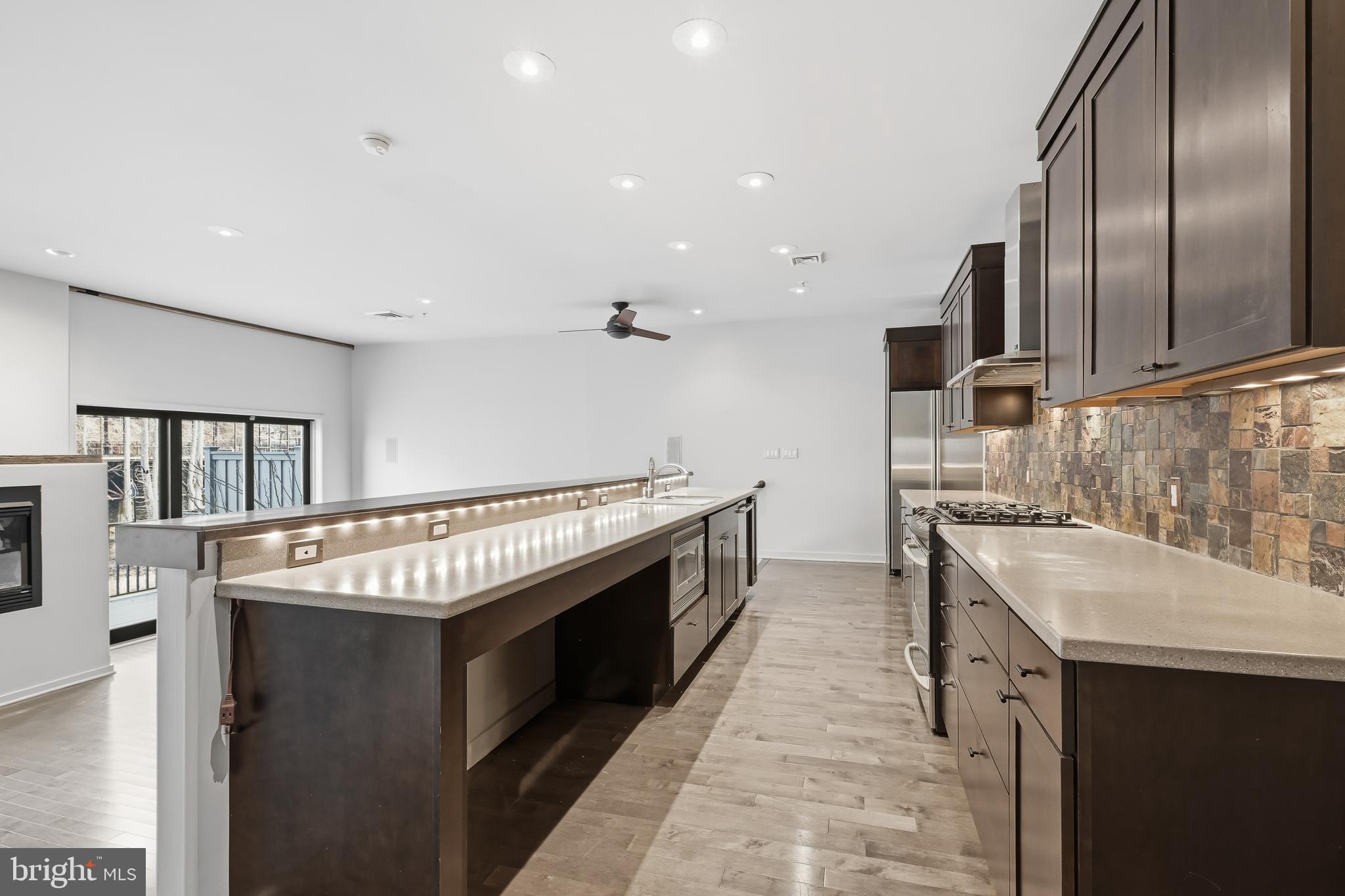 118 Bancroft Mills Road Wilmington, DE 19806 - Photo 6 of 36 a kitchen with stainless steel appliances granite countertop a sink and a stove