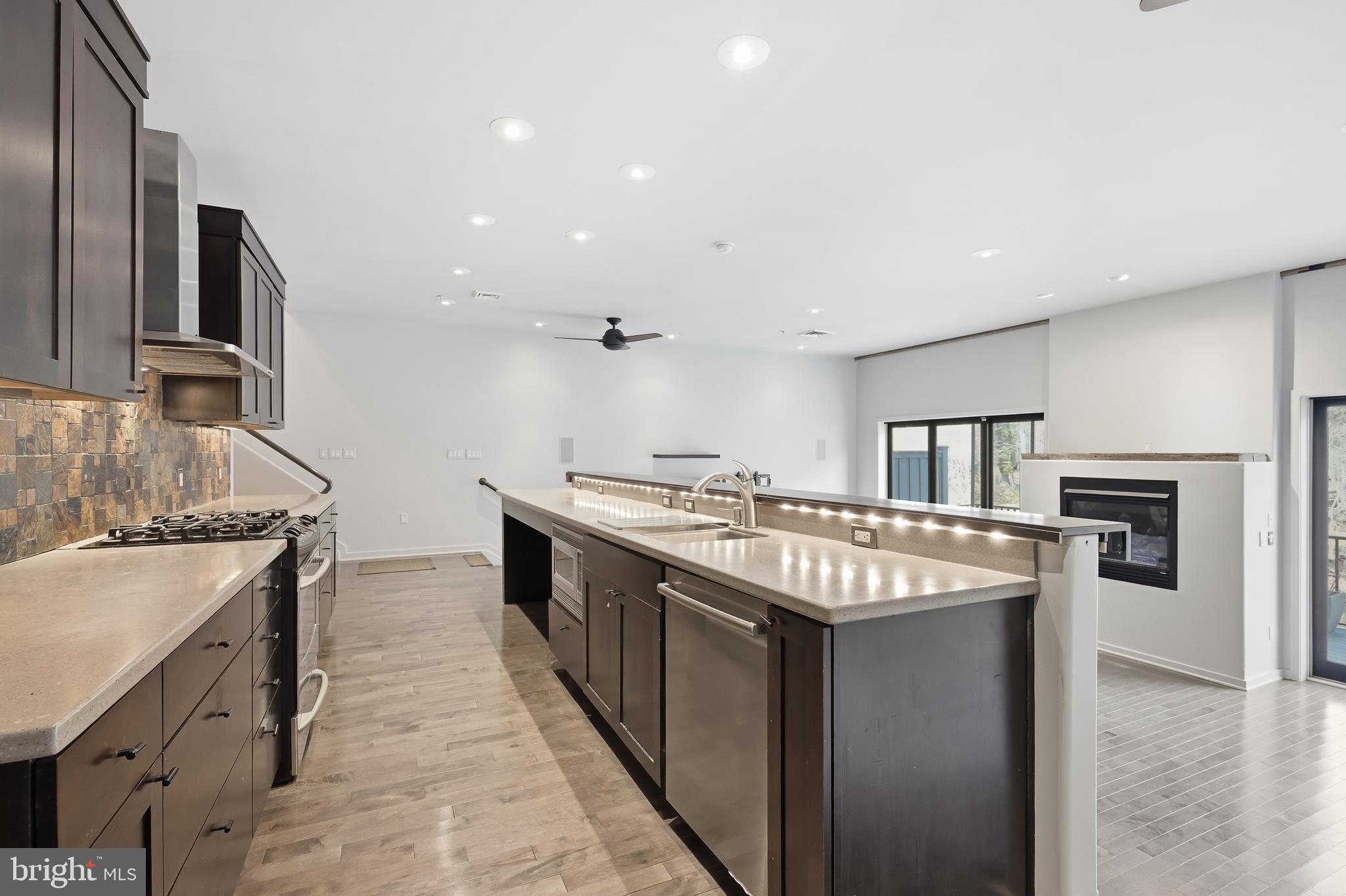 118 Bancroft Mills Road Wilmington, DE 19806 - Photo 8 of 36 a kitchen with stainless steel appliances granite countertop a sink stove and refrigerator
