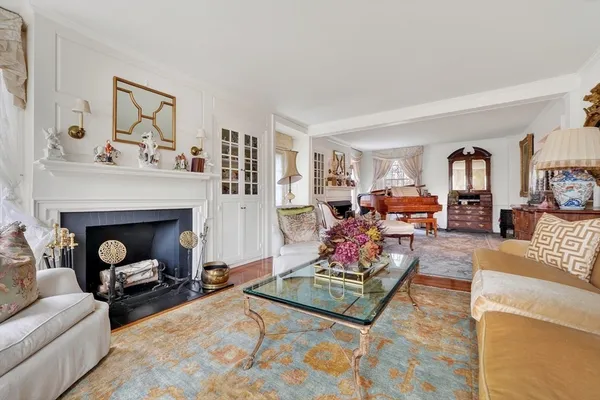 a living room with furniture or couch and a large window