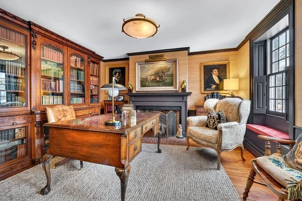 a living room with furniture and large windows