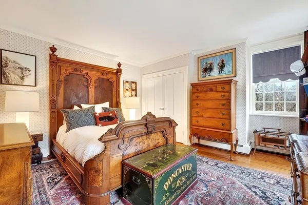 a bed room with a bed and windows
