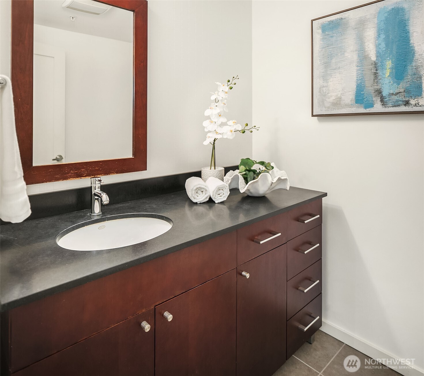 76 Cedar Street, Unit 405 Seattle, WA 98121 - Photo 14 of 32 a bathroom with a sink vanity and a mirror