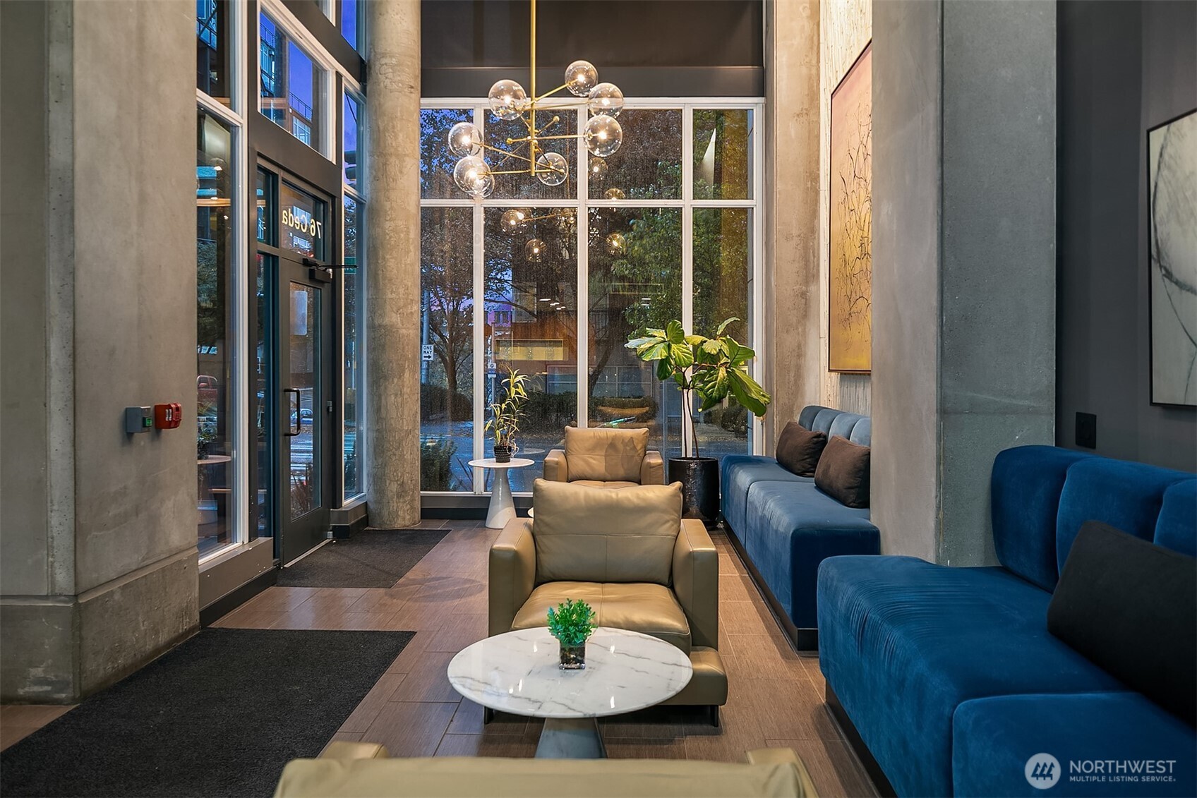 76 Cedar Street, Unit 405 Seattle, WA 98121 - Photo 15 of 32 a living room with furniture and a floor to ceiling window