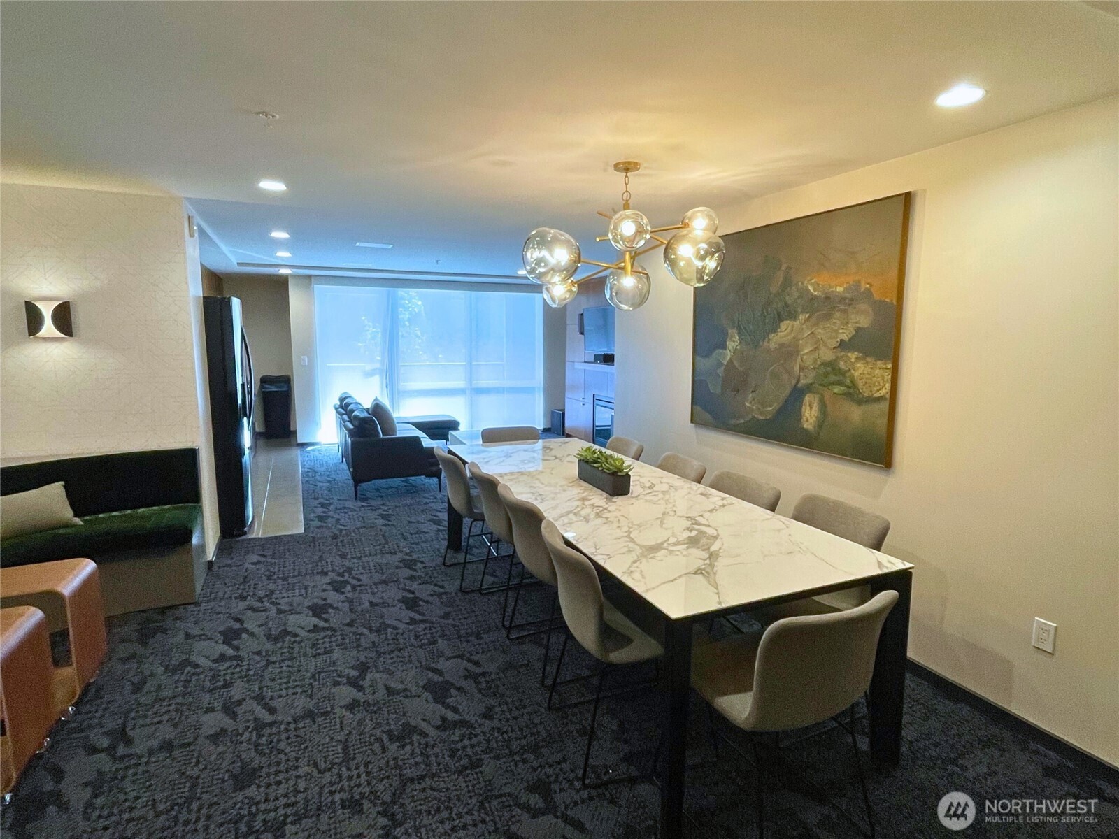 76 Cedar Street, Unit 405 Seattle, WA 98121 - Photo 26 of 32 a view of a dining room with furniture and wooden floor