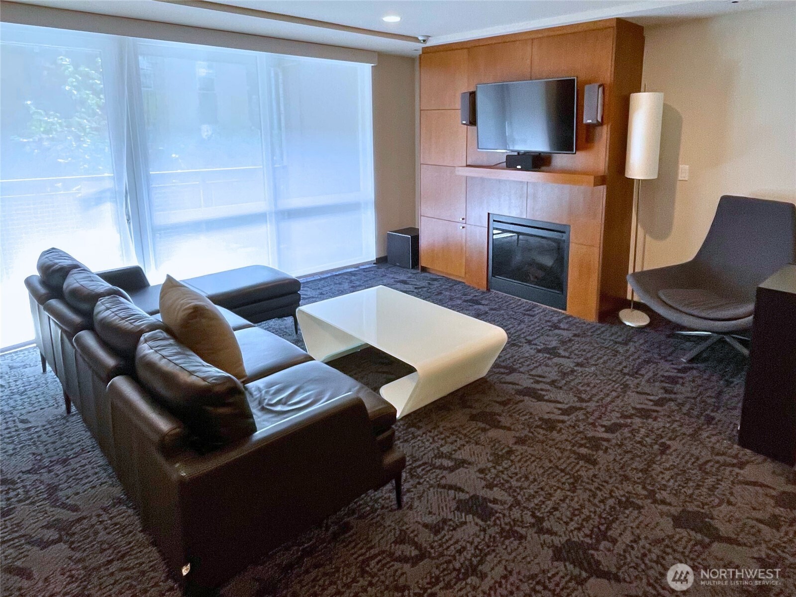 76 Cedar Street, Unit 405 Seattle, WA 98121 - Photo 28 of 32 a living room with furniture and a fireplace