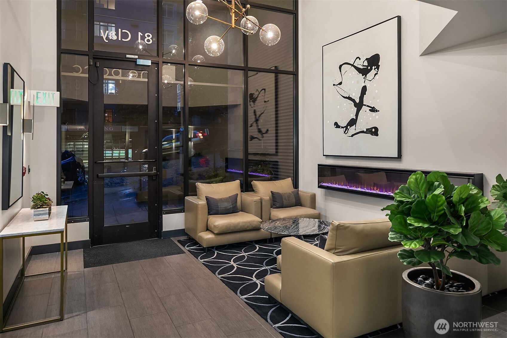 76 Cedar Street, Unit 405 Seattle, WA 98121 - Photo 31 of 32 a living room with furniture and flowers