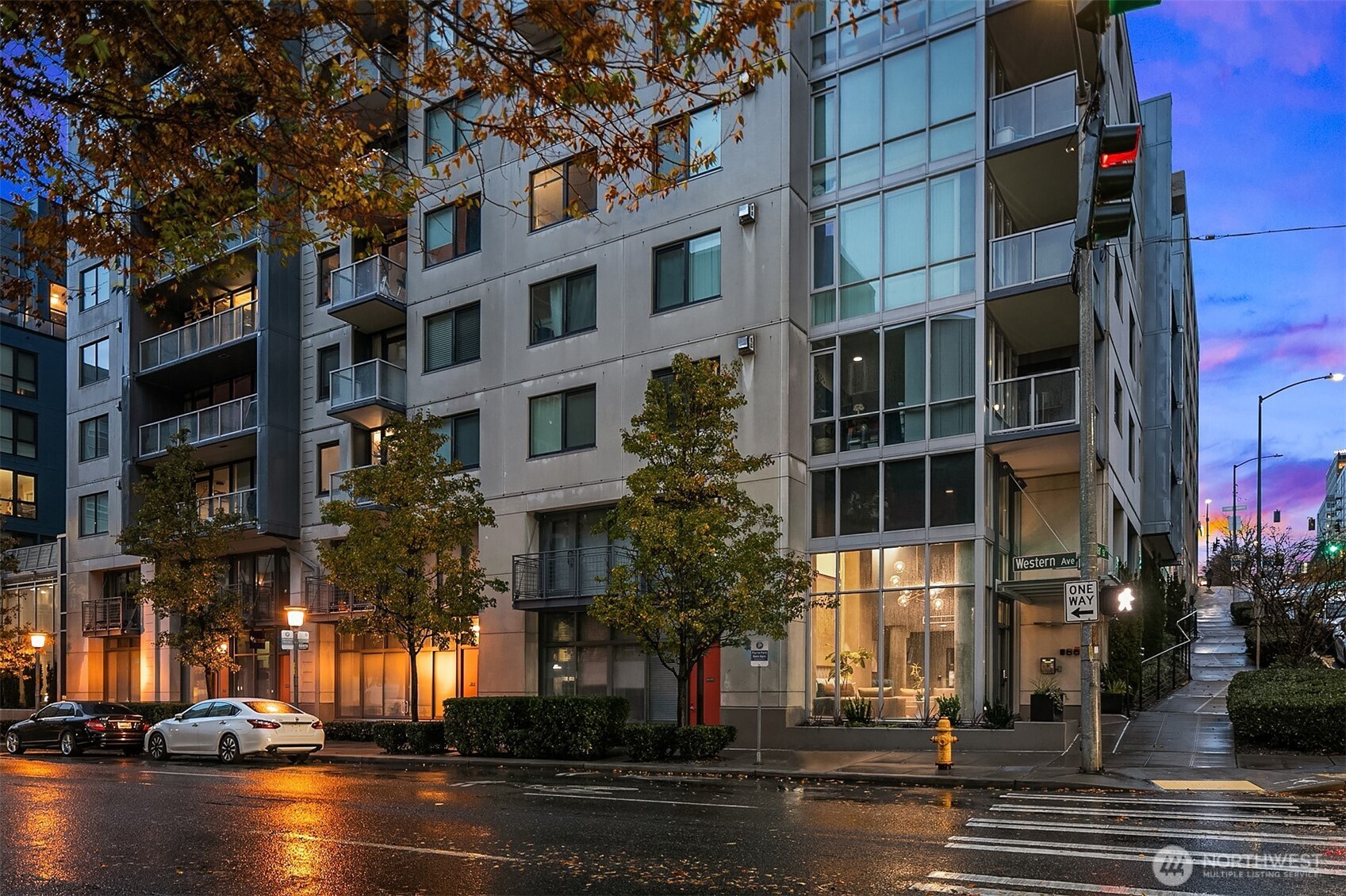76 Cedar Street, Unit 405 Seattle, WA 98121 - Photo 32 of 32 a city street lined with tall buildings and a fountain