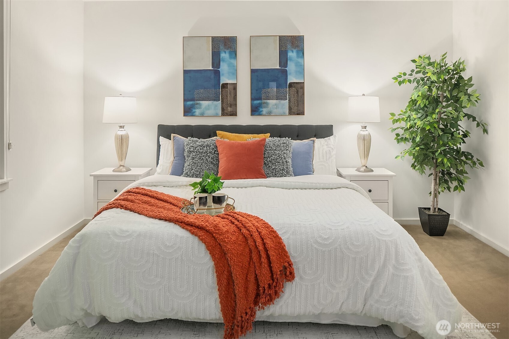 76 Cedar Street, Unit 405 Seattle, WA 98121 - Photo 9 of 32 a bedroom with a bed and a potted plant