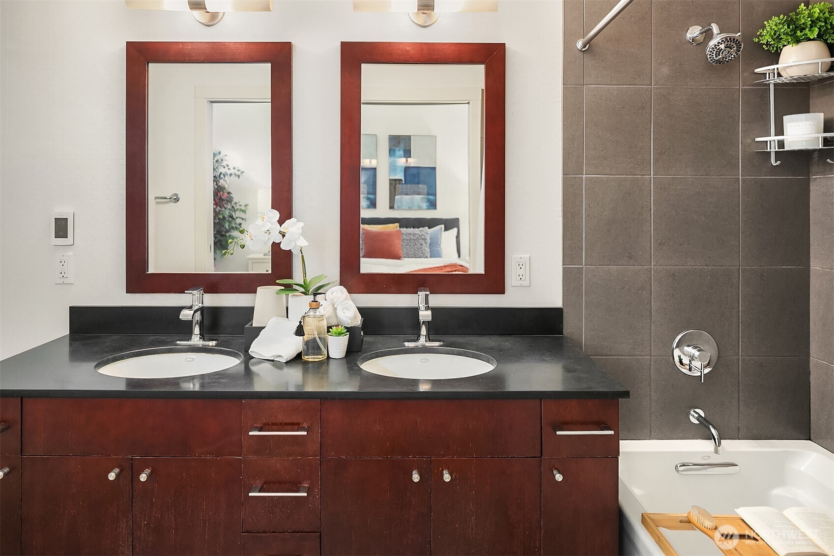 76 Cedar Street, Unit 405 Seattle, WA 98121 - Photo 10 of 32 a bathroom with double vanity sinks and a mirror