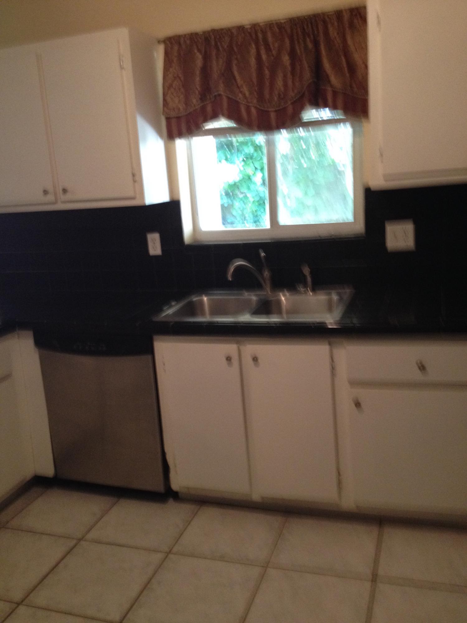 11198 Mandarin Street Boca Raton, FL 33428 - Photo 5 of 22 a kitchen with a sink and a window