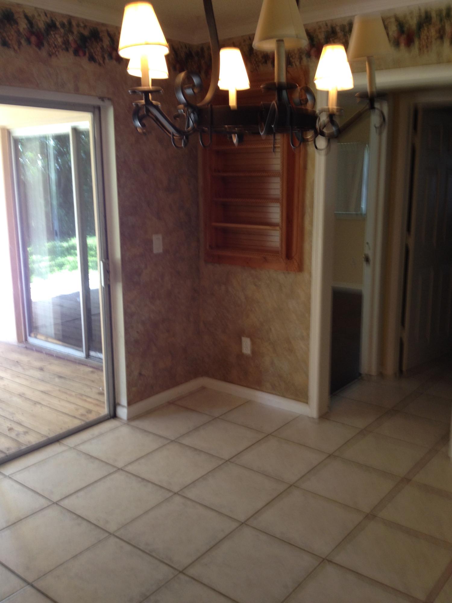 11198 Mandarin Street Boca Raton, FL 33428 - Photo 10 of 22 a view of a livingroom with furniture and chandelier fan