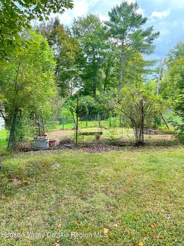 a view of a yard with a tree