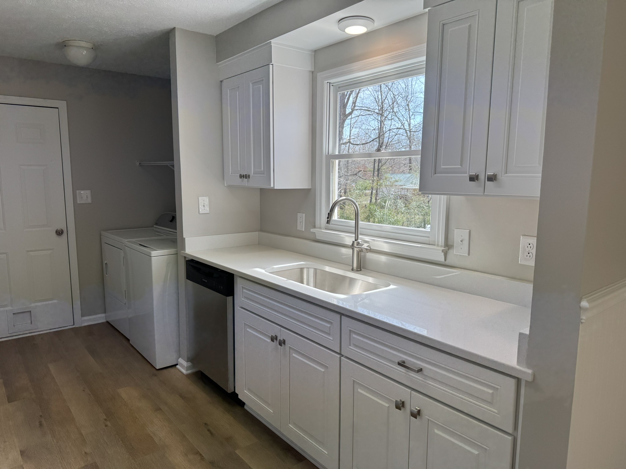 226 Nottingham Road Dickson, TN 37055 - Photo 7 of 17 a kitchen with a sink cabinets and window