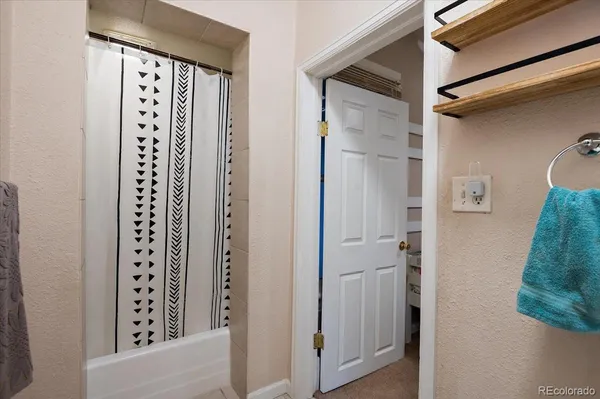 a view of a hallway with windows