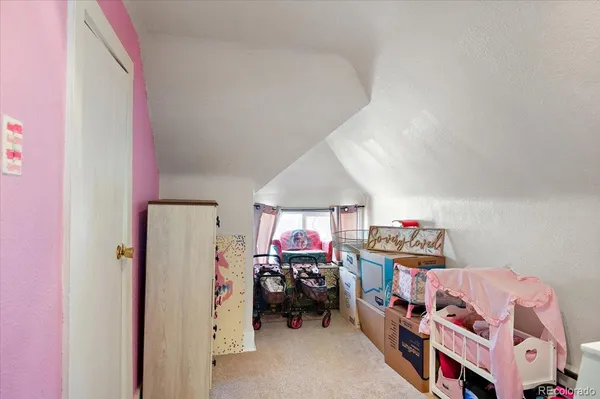 a bedroom with furniture and a bed