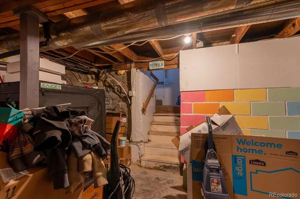 a view of walk in closet with clothes