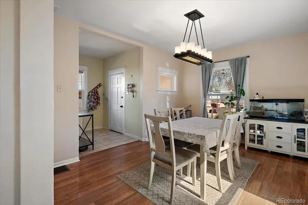 a view of a dining room with furniture window and wooden floor