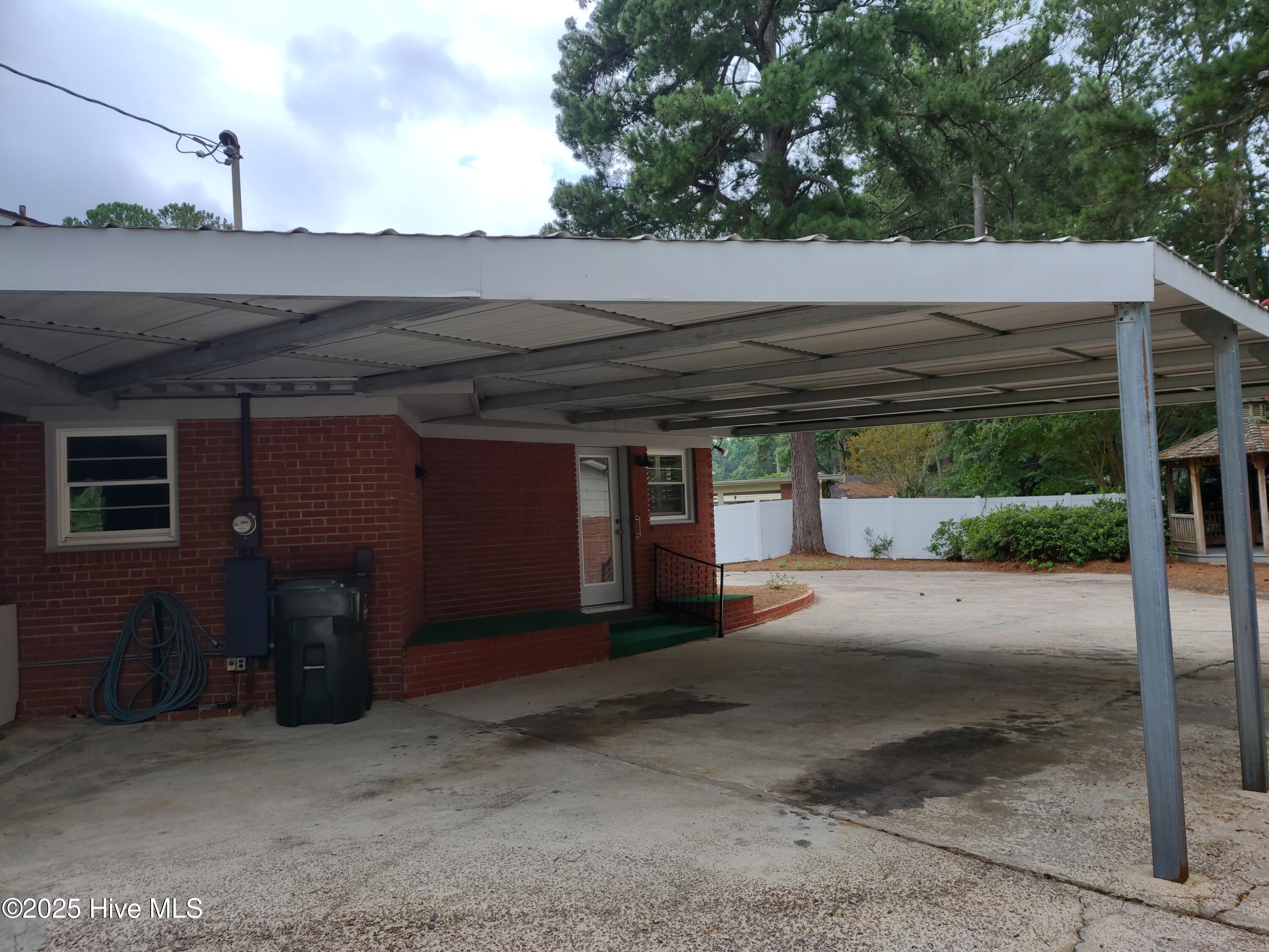 1109 Treemont Road Northwest Wilson, NC 27896 - Photo 17 of 20 large carport attached to back door/ garage