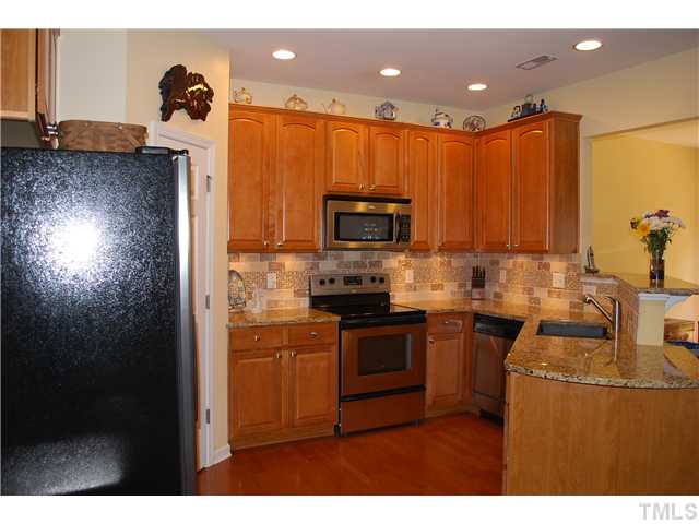 2938 Settle In Lane Raleigh, NC 27614 - Photo 1 of 12 Fully Upgraded Kitchen with Granite, Stainless Steel Appliances and Tile/Glass Backsplash