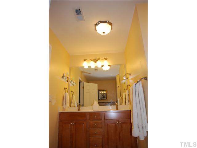 2938 Settle In Lane Raleigh, NC 27614 - Photo 7 of 12 Master Bath has Dual Sinks, Garden Tub and Shower stall. Also has private water closet!