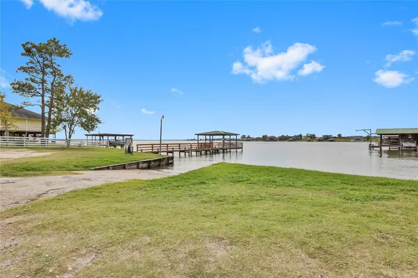 a view of a lake with a big yard