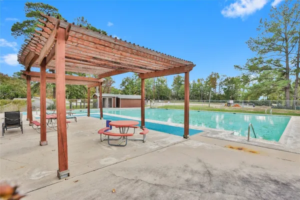 a view of a swimming pool with a patio