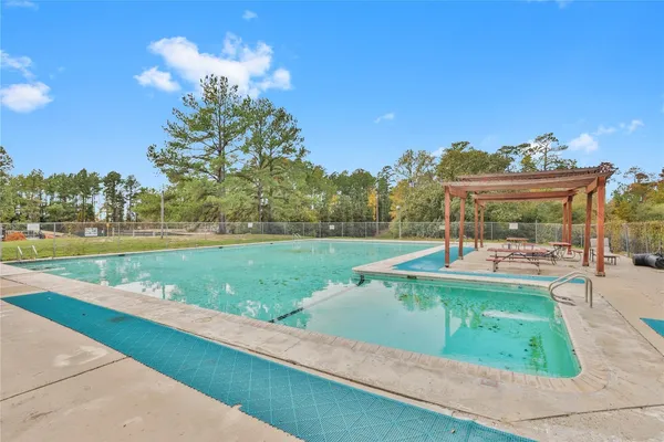 a view of a house with yard and deck