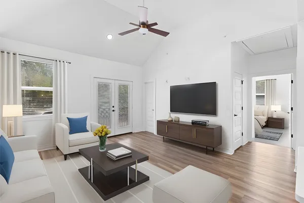 a living room with furniture and a flat screen tv
