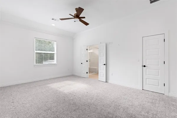 a view of a livingroom with a ceiling fan and window