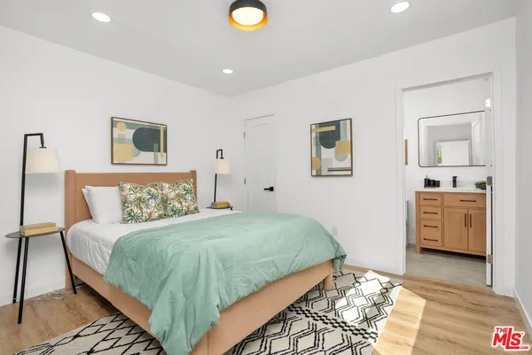 a bedroom with a bed and a couch