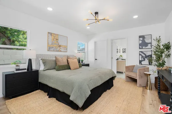 a bedroom with a bed and furniture