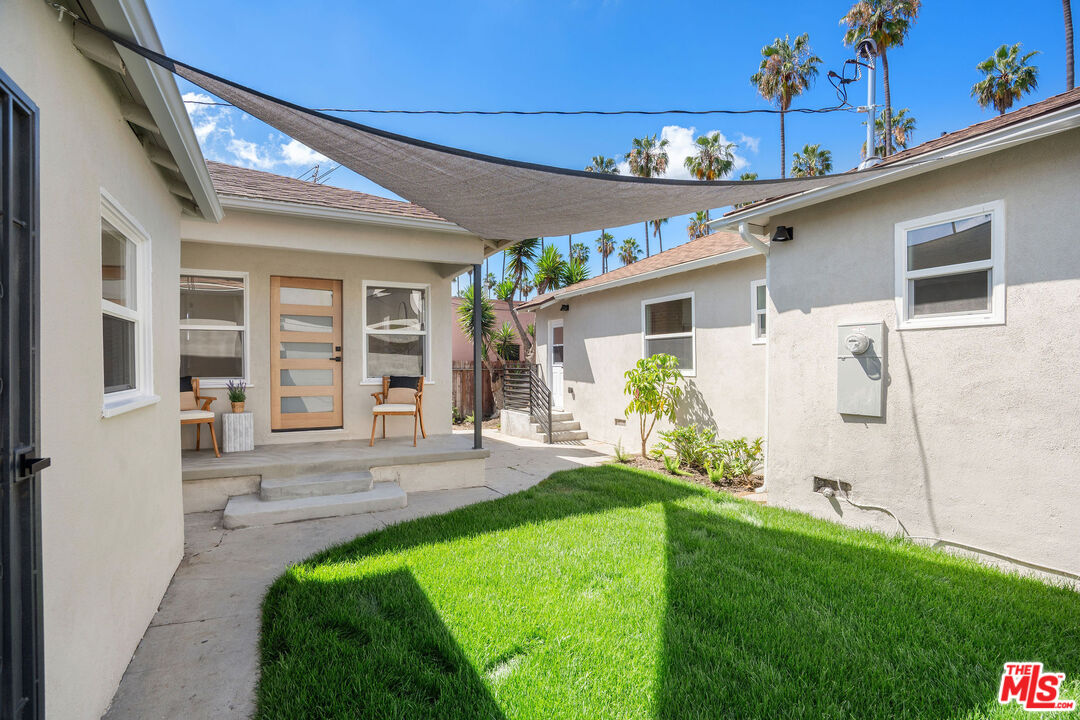 5418 South Rimpau Boulevard Los Angeles, CA 90043 - Photo 15 of 23 a front view of a house with a yard