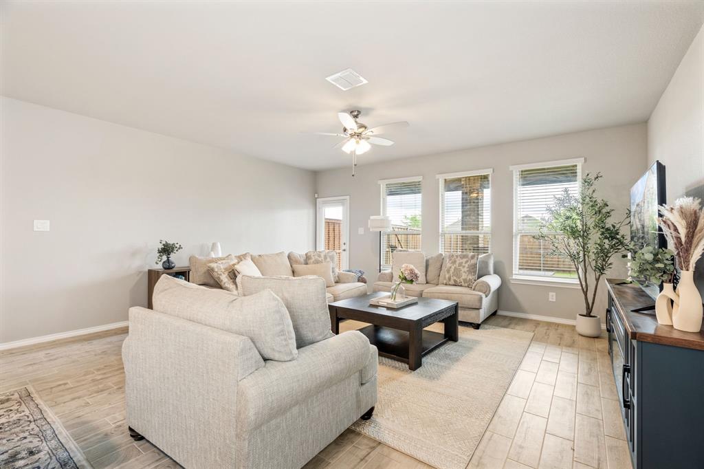 321 Pasture Drive Midlothian, TX 76065 - Photo 9 of 40 a living room with furniture and a chandelier