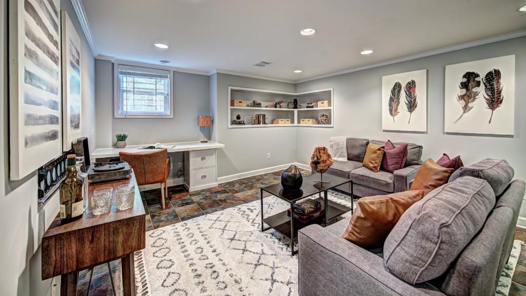 484 Wimbledon Road Northeast Atlanta, GA 30324 - Photo 1 of 1 a living room with furniture a rug and wooden floor