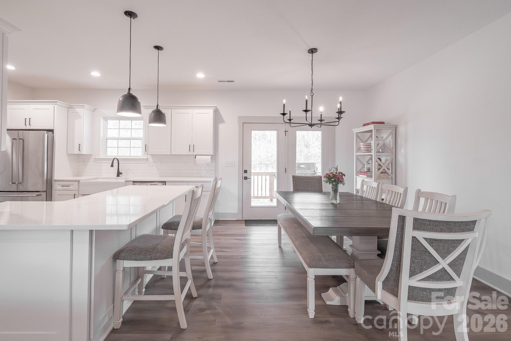 731 Miles Road Dallas, NC 28034 - Photo 11 of 45 a view of a dining room and chandelier